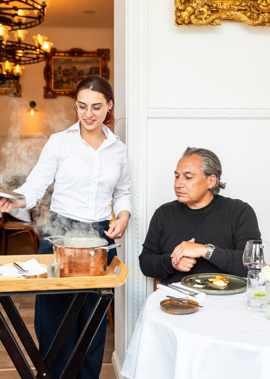 Villa Coucou Staff serving dining table